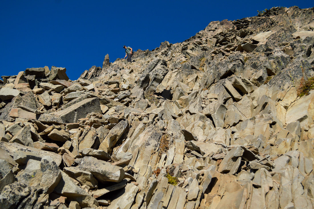 climbing up Mt. Thielsen's rock wall