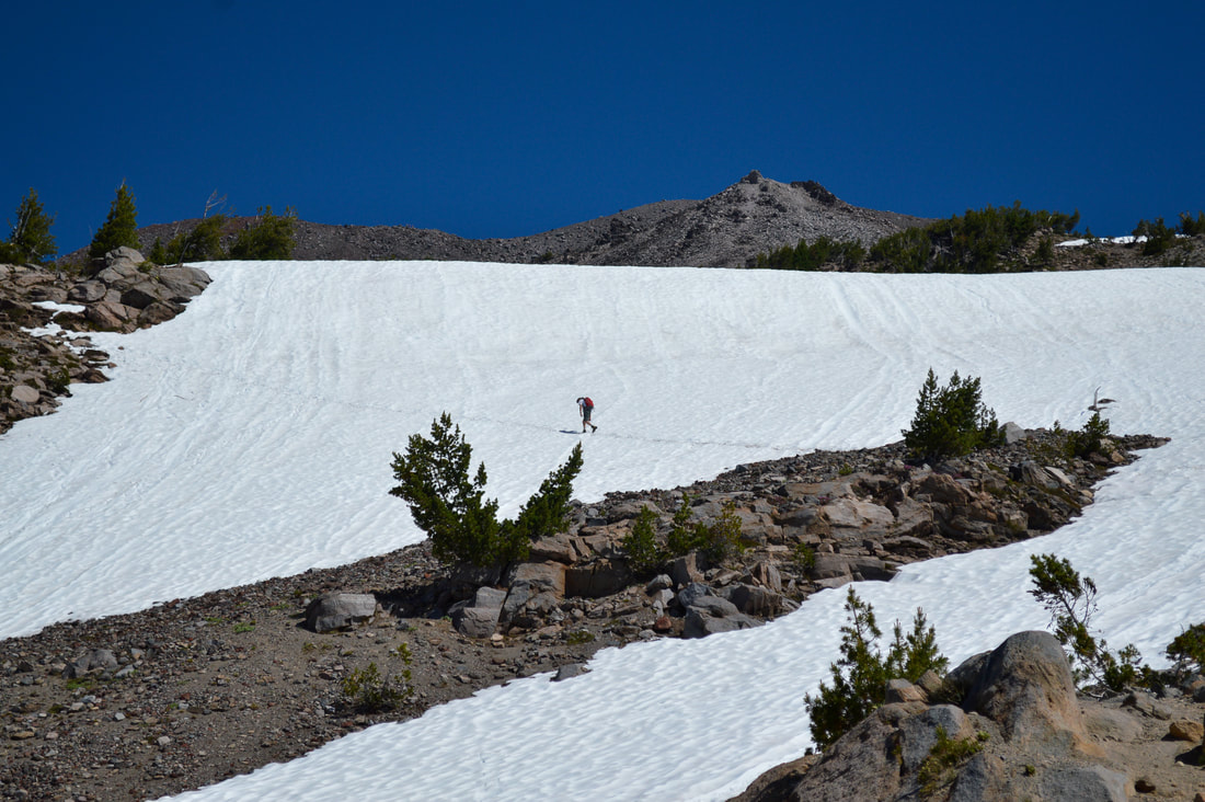 climbing up snow fields South Sister climber trail